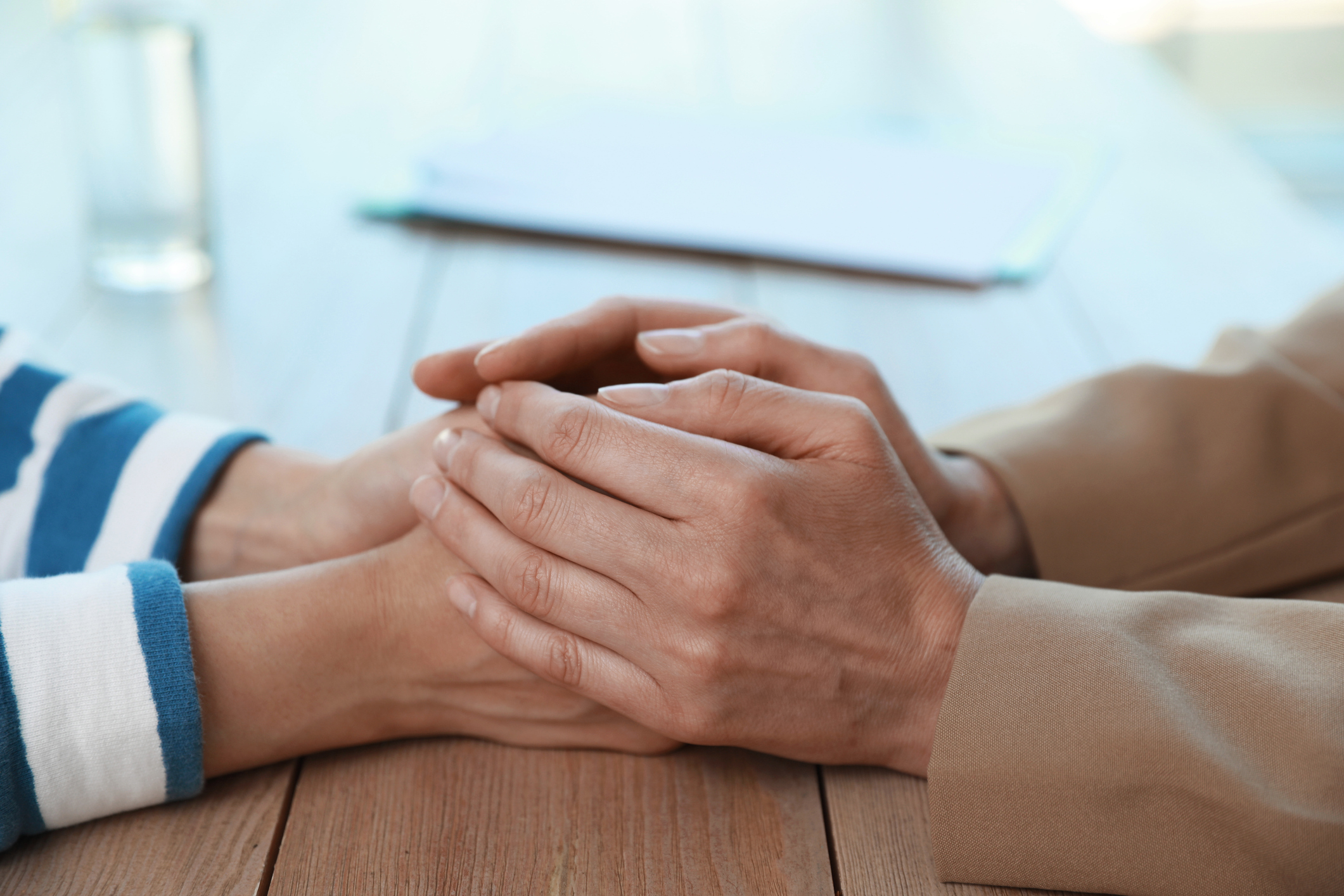 a close-up of hands shaking