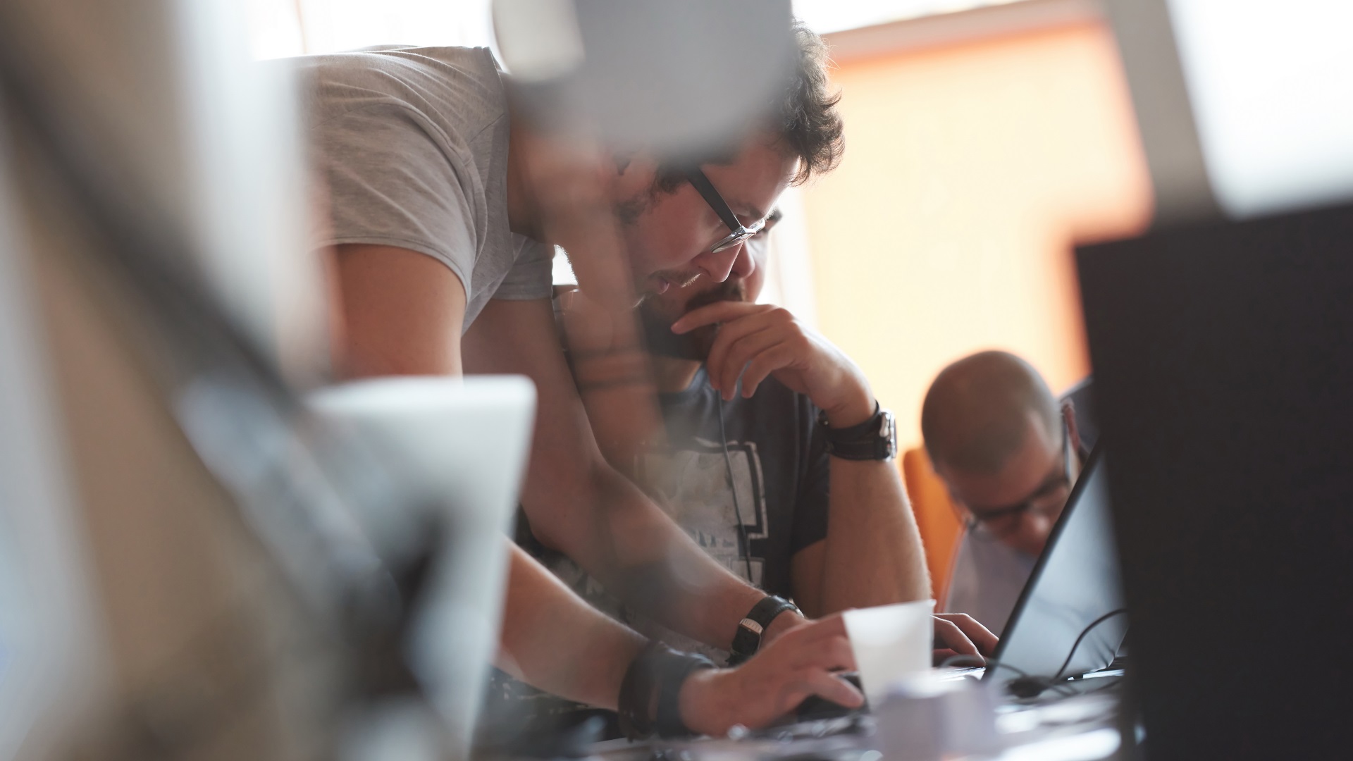 a person looking at a computer screen